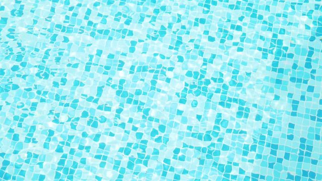 water ripples with see the floor tiles in pool 4k video