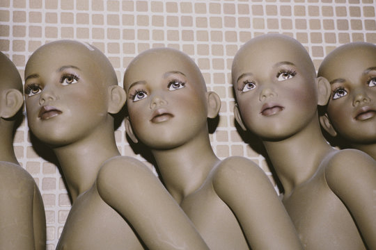 Row of mannequin children
