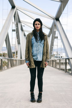 Portrait Of An Alternative Woman Standing On A Modern Bridge.