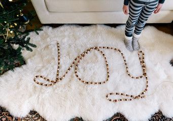 Wood garland spells JOY