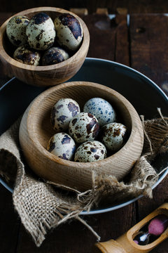 Quail eggs in a rustic setting.