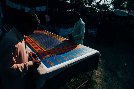 Pakistani craftsmen at work on a sunny day