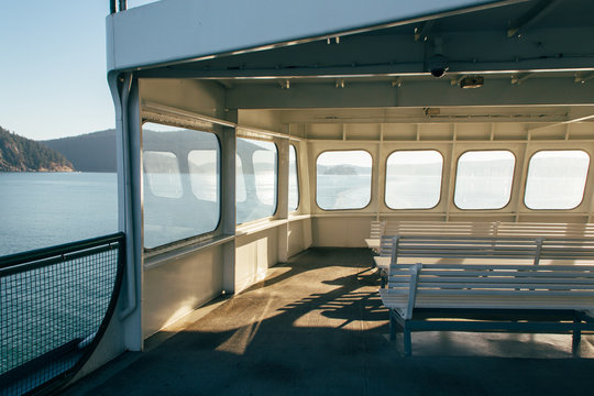 Windows Glowing With Sunlight On Upper Deck of Passenger Ferry Boat