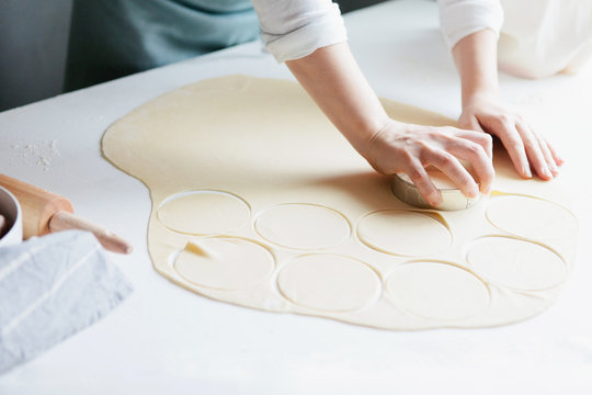 Woman making meat dumplings
