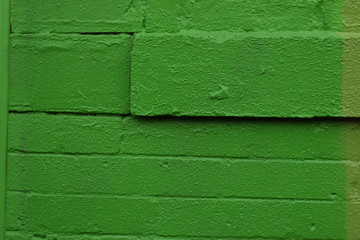 Green Spray Paint on Brick