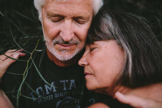 Closeup of __ld couple embracing in the branches