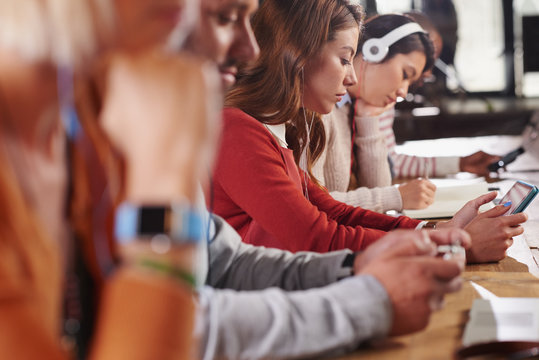 Group of students studying in shared workspace