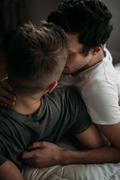 Young gay couple in bedroom