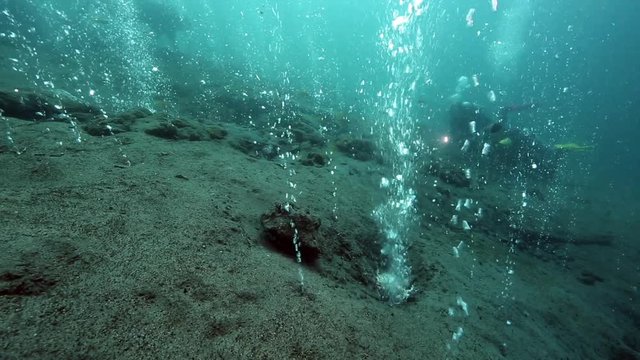 Scuba diving over hot bubbles from underwater volcano, Pulau Weh, Aceh, Indonesia 