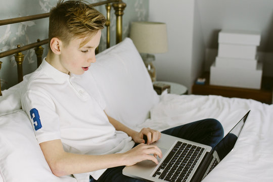 Teenage boy using a laptop