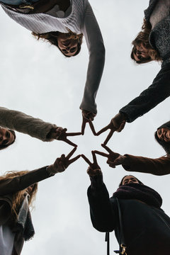 Friends Doing a Star Shape with Fingers