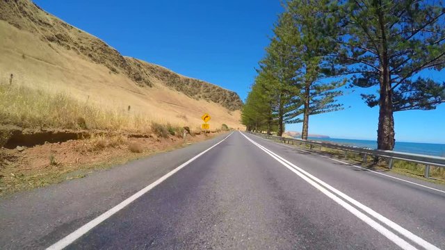 4k Vehicle POV, driving along coastal highway with ocean views, taken near Normanville in the Fleurieu Penninsula, South Australia.