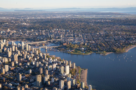 Beautiful Aerial View of Vancouver Downtown, British Columbia, Canada, during a bright spring sunset.