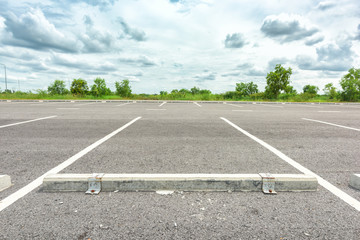 Empty parking lot against a beautiful blue sky