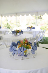 Wildflower Wedding Centerpieces with Black Eyed Susans, Snapdragons, and Delphinium on a Reception Table with White Tablecloth