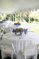 Wildflower Wedding Centerpieces with Black Eyed Susans, Snapdragons, and Delphinium on a Reception Table with White Tablecloth