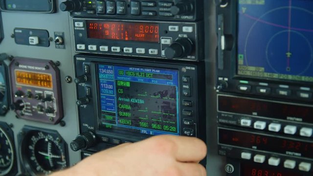 A close up shot of an airplane's controls being manipulated by the pilot.