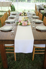 Vintage Wedding Decor Mismatched China on a Wood Table with Flowers