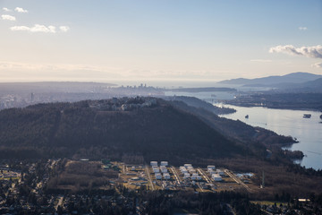 Aerial view of Burnaby Moutain, SFU, and Vancouver Downtown in the background.
