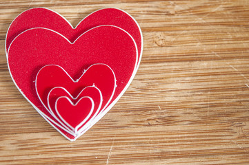 Closeup of red hearts figure on wooden table