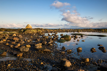 Beautiful nature landscape view on a rocky shore during a sunny winter day. Picture taken in Hornby Island, British Columbia, Canada.