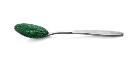 Spirulina powder in spoon on white background