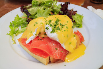 Poached egg with raw salmon
