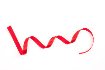 Beautiful red ribbon twist spiral isolated on white background.