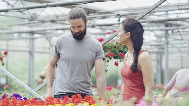  Cheerful Couple Shopping In Garden Center