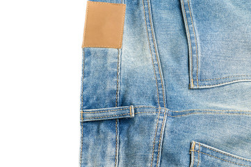 Blank leather label and back pocket denim jeans on white background