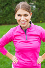 Attractive female with pink sportswear