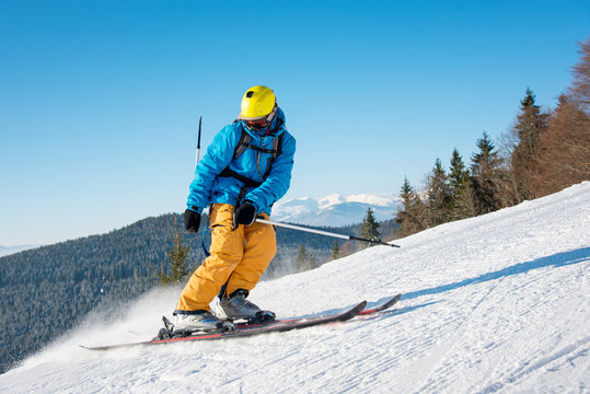 Shot of a professional skier riding the slope on a beautiful winter day copyspace ski resort recreation travelling tourism vacation extreme adrenaline