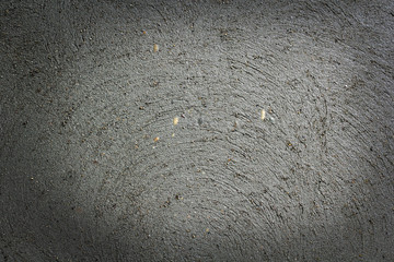Plasterer concrete worker at the wall of house construction