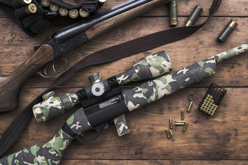 Small caliber 22 long rifle and double-barreled hunting rifle