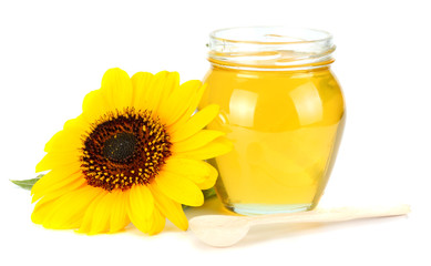 Sunflower with honey isolated on white background. Glass bank of honey.
