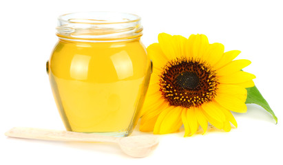 Sunflower with honey isolated on white background. Glass bank of honey.
