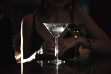 Two glasses of martini coctail in a bar