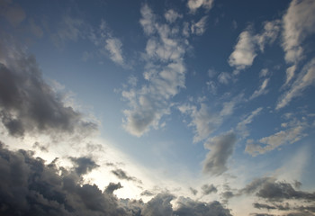 Grey clouds in the blue sky