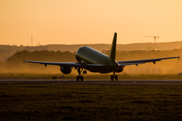 Take off of a passenger aircraft at sunset of the day