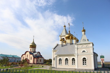 Fototapeta na wymiar church, temple, religion, orthodox, orthodox, monastery, bell tower, crosses, architecture, white, gold, domes, bells, building, landscape, admire the view of the temple, sky, summer, exterior, Russia
