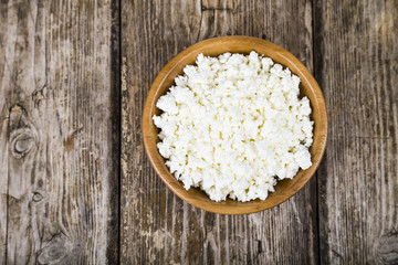 Cottage cheese in a wooden bowl