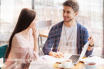 Smiling man looking at beautiful girl