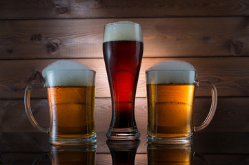 Three glasses of different colored beer