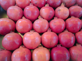 Large number of Pomegranates beautifully decorated at a shop