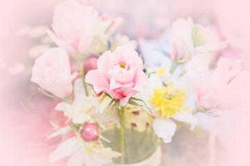 Obraz na płótnie Canvas Beautiful tender bouquet from crepe paper flower. Pink handmade paper roses. Paper floral art. Arificial Flower
