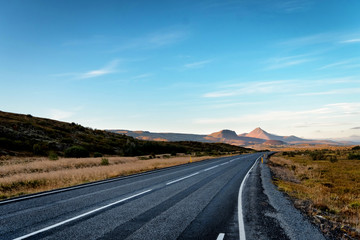 Scenic view of remote road on Iceland surrounded by dramatic landscape.