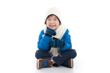 Happy asian child in winter clothes