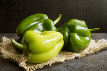 Fresh green pepper on the burlap