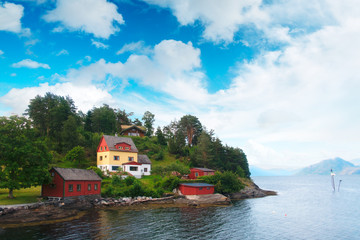 Fototapeta na wymiar Typical norwegian landscape with red house