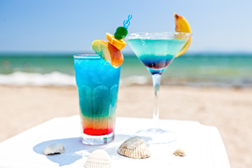 Blue cocktails by the beach